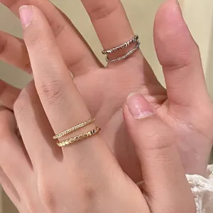 Set of four minimalist stackable rings with heart patterns and zircon stones in gold and silver