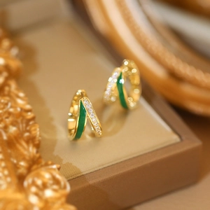 Elegant gold double hoop earrings with green enamel and sparkling zircon inlay