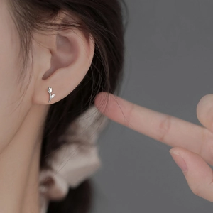 S925 sterling silver tulip stud earrings with sparkling cubic zirconia on a model