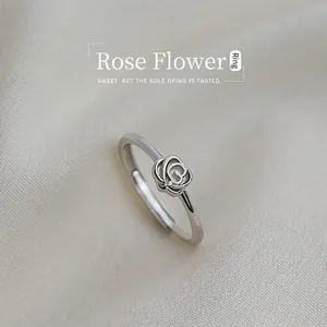Macro shot of S925 silver rose ring featuring hollow petals and adjustable open band
