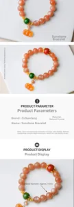 Macro view of 11mm natural sunstone beaded bracelet with a pumpkin-shaped charm