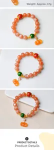 Detailed view of 11mm sunstone bead bracelet with pumpkin pendant and gold spacers