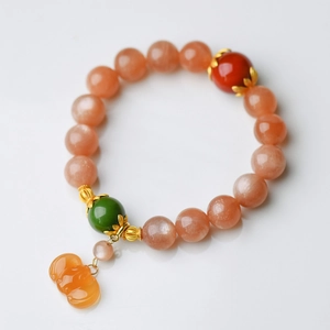 Natural 11mm sunstone beaded bracelet with red rutilated quartz and carved pendant