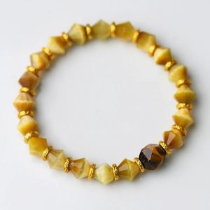 Bracelet en oeil de tigre naturel facetté de 8mm avec perles intercalaires dorées