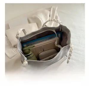 Spacious tote bag interior showing capacity for tablet, books, and daily essentials