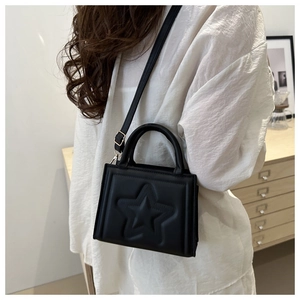 Fashionable black faux leather crossbody bag with embossed star pattern for women