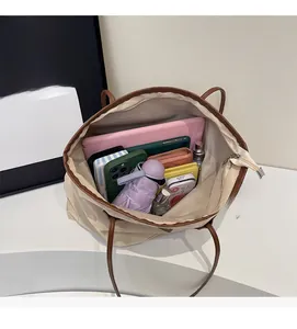 Top view showing spacious interior and compartments of this beige canvas tote bag