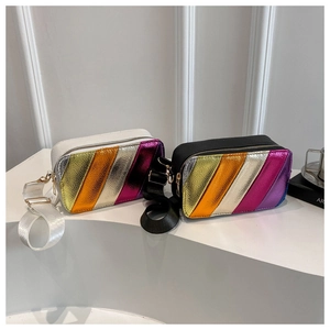 Detail of colorful metallic faux leather stripes and zipper on rectangle crossbody bag