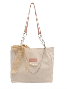Grand sac cabas beige avec anses roses, breloques perles et nœud en dentelle