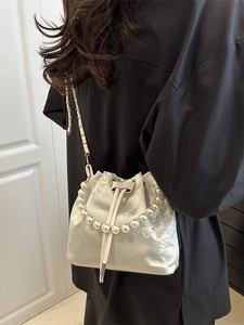 Elegant cream satin bucket bag with floral embroidery and pearl handle for women