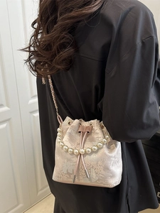 Pink pearl handle bucket bag with floral embroidery and gold chain strap for women