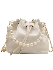 Elegant ivory satin bucket bag with floral embroidery and luxury pearl handle