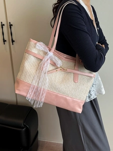 Chic beige straw tote bag with pink leather trim and white lace bow for casual fashion