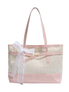 Straw tote bag in cream white with pink leather straps and a large lace bow accent