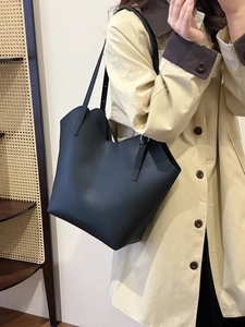 Minimalist black lychee leather tote bag with long straps for chic daily commuting use
