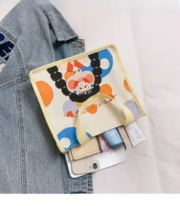 Detailed view of canvas lunch bag showing internal capacity for phone and cosmetics