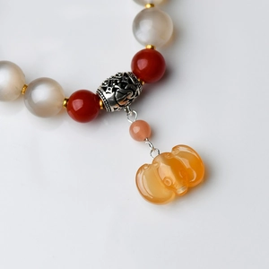 Natural Moonstone and Rabbit Fur Quartz beaded bracelet with orange pumpkin charm detail