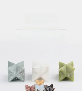 Macro view of handmade star-shaped Merkaba natural crystal stones in various minerals