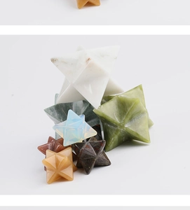 Macro detail of assorted natural crystal Merkabah stones with geometric multi-faceted cuts