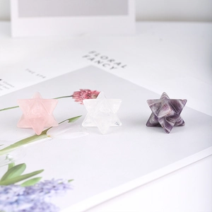 Three natural Merkaba crystal stars including rose quartz and amethyst for office decor