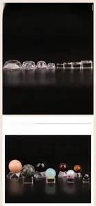 Clear acrylic and glass geometric stands for displaying crystal balls and mineral spheres