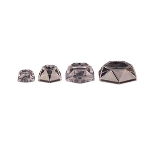 Set of four clear hexagonal crystal ball display stands with faceted glass design
