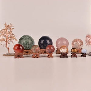 Natural crystal ball collection with vintage carved wooden bases for home decor