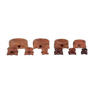 Solid wood crystal ball display stands in various sizes with Chinese carved wood patterns