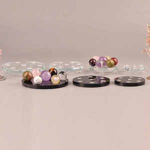 Seven-star crystal ball set with engraved glass bases and assorted natural gemstone spheres