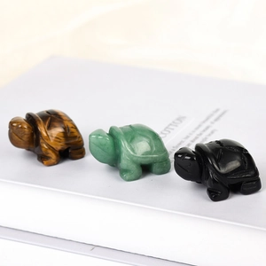 Hand-carved crystal turtle figurines in tiger eye, aventurine and obsidian stones