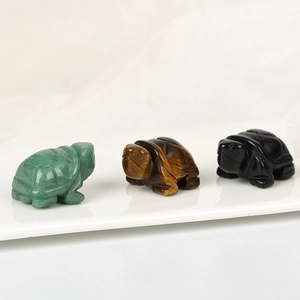 Three hand-carved natural crystal turtle figurines in aventurine, tiger eye and obsidian