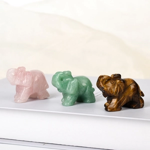 Hand-carved gemstone elephant figurines in rose quartz, aventurine, and tiger eye stone