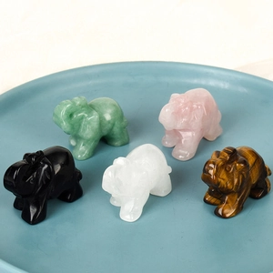 Set of five natural semi-precious gemstone elephant figurines in a blue ceramic dish
