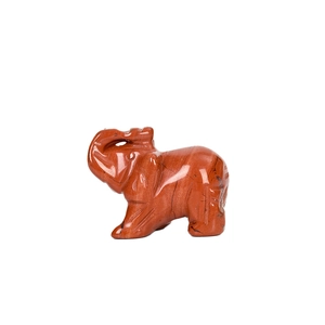 Hand-carved red jasper elephant figurine with natural black mineral veins on white background