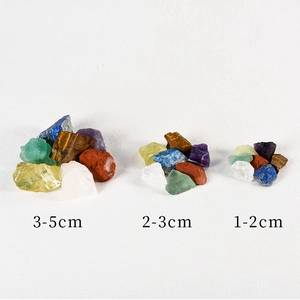 Assorted natural crystal stones in various sizes 1-5cm on a clean white background