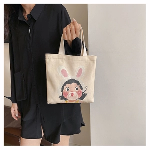 Borsa a secchiello in tela con stampa di ragazza cartone animato e manici stile minimal