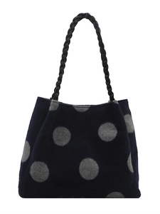 Vintage navy blue polka dot tote bag with large gray spots and woven leather handles