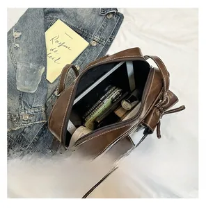 Top view of large capacity dark brown leather bag showing spacious interior for essentials