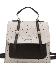 Polka dot mini backpack in cream leather with brown contrast straps and rabbit logo