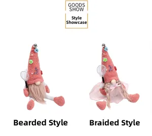 Close-up of pink Christmas gnome dolls with butterfly floral hats and mesh tutus