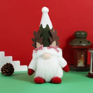 Christmas gnome plush with deer antlers and white beard on a festive holiday background