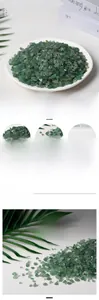 Detailed close-up of natural green aventurine chips with a smooth polished wax finish