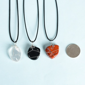 Handmade wire wrapped natural crystal pendants on black cords with three stone types