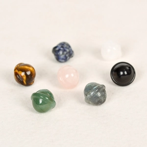 Mini natural gemstone planets including rose quartz and tiger eye carved stones