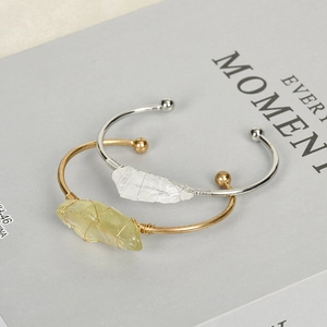 Handmade open metal bracelets with natural crystal stones and wire-wrapped detail