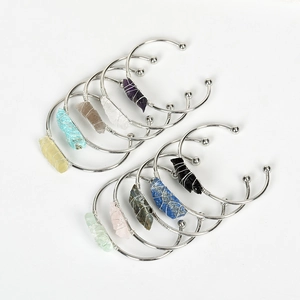 10-piece silver metal open bangle set featuring hand-wrapped natural raw crystals