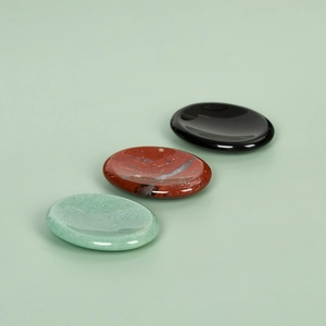 Polished natural aventurine and obsidian thumb stones for crystal healing energy