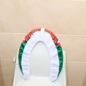 Detail of plush Christmas toilet cover with red and green patterns and elastic band