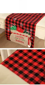 Detail of red and black plaid Christmas table runner with Letters to Santa embroidery