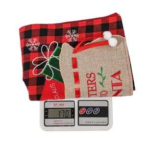 Close-up of red buffalo plaid Christmas stocking with Letters to Santa jute pocket